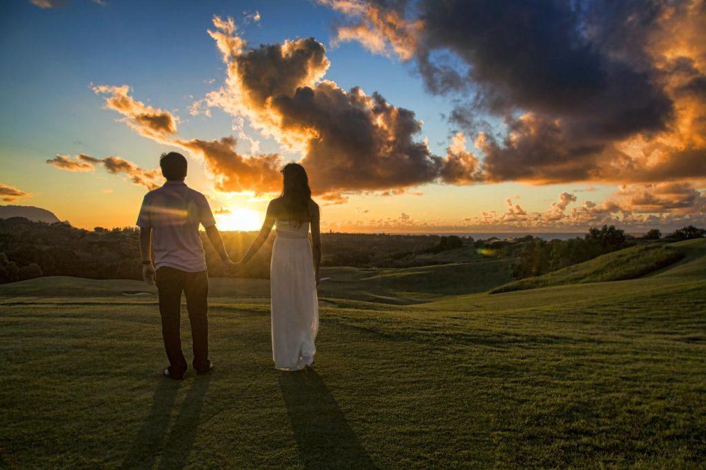 A man and a woman hold hands